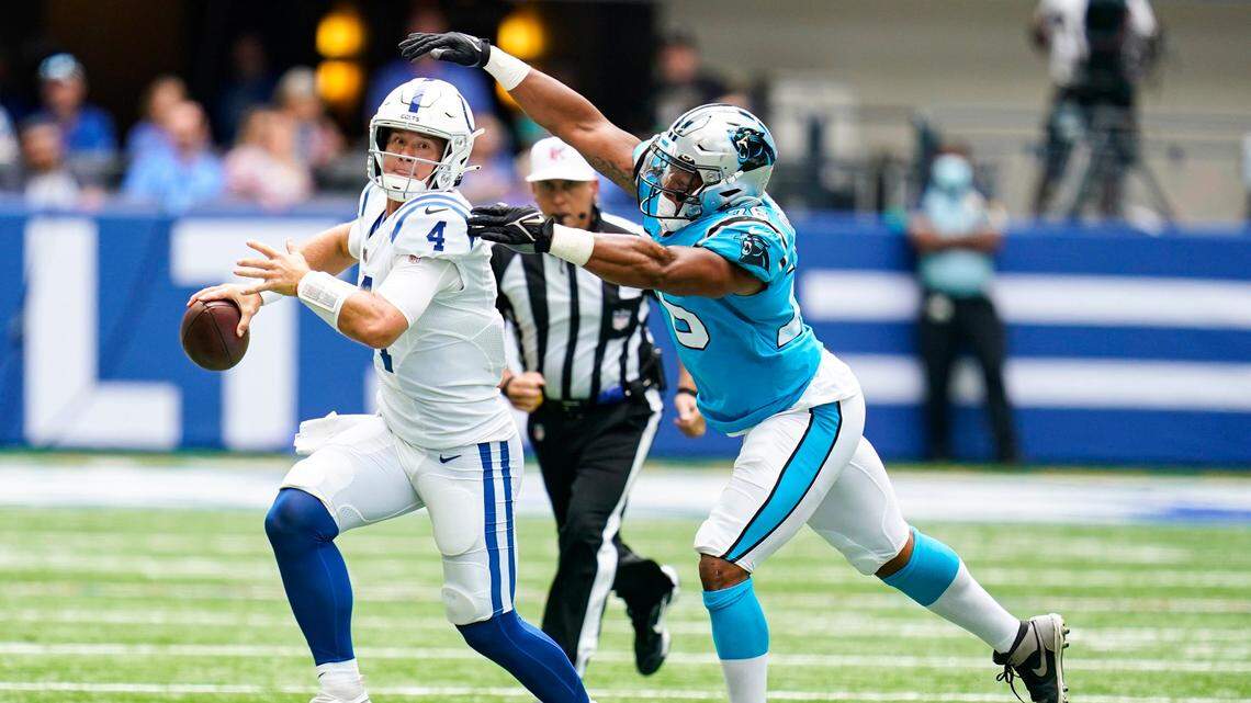 Carolina Panthers defensive end Kendall Donnerson (76) chases Indianapolis Colts quarterback Sam Ehlinger (4) during the second half of an NFL exhibition football game in Indianapolis on Sunday. Indianapolis won, 21-18.