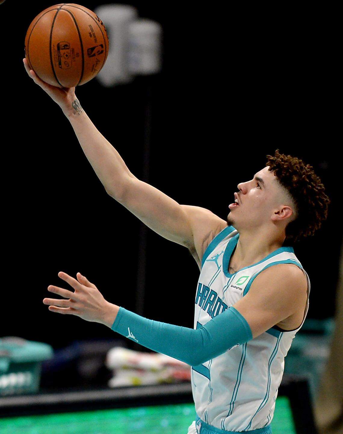 Charlotte Hornets guard LaMelo Ball drives to the basket for a layup. Eric Collins, who calls Hornets games on TV, said he realized when Ball played well against his older brother that “this kid has got a chance to be really good.”