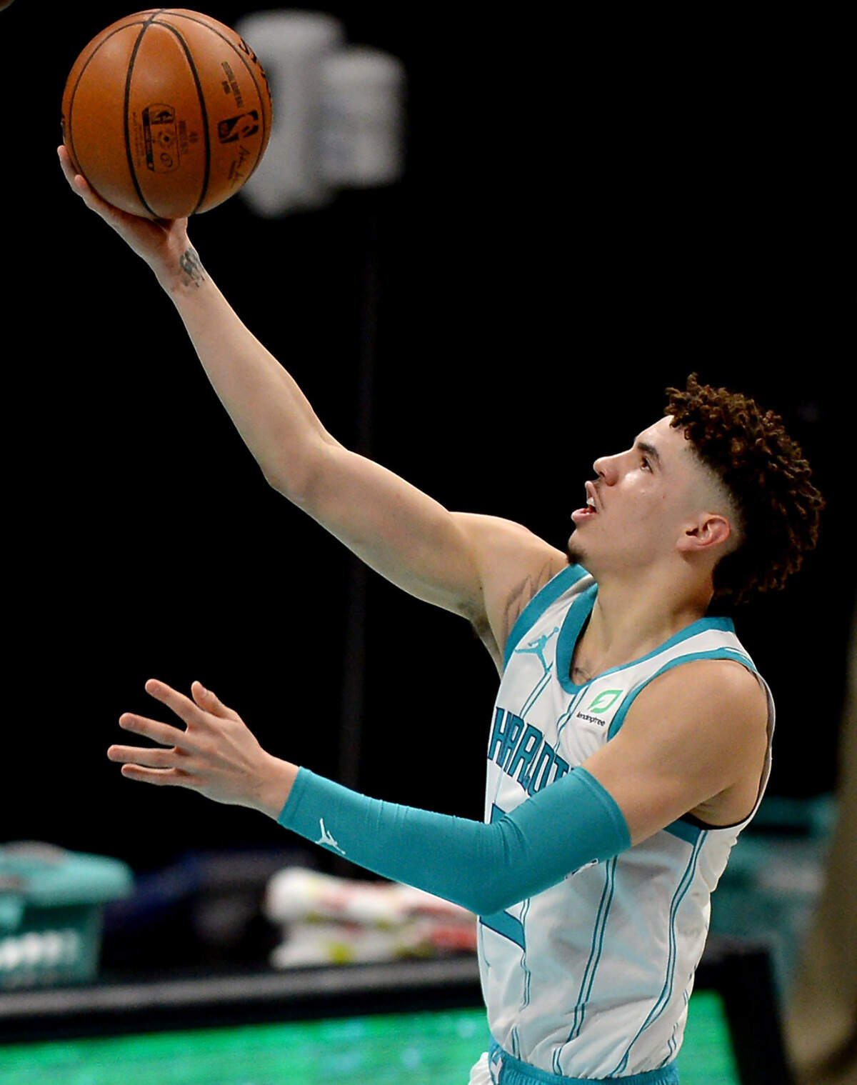 Charlotte Hornets guard LaMelo Ball drives to the basket for a layup. Eric Collins, who calls Hornets games on TV, said he realized when Ball played well against his older brother that “this kid has got a chance to be really good.”