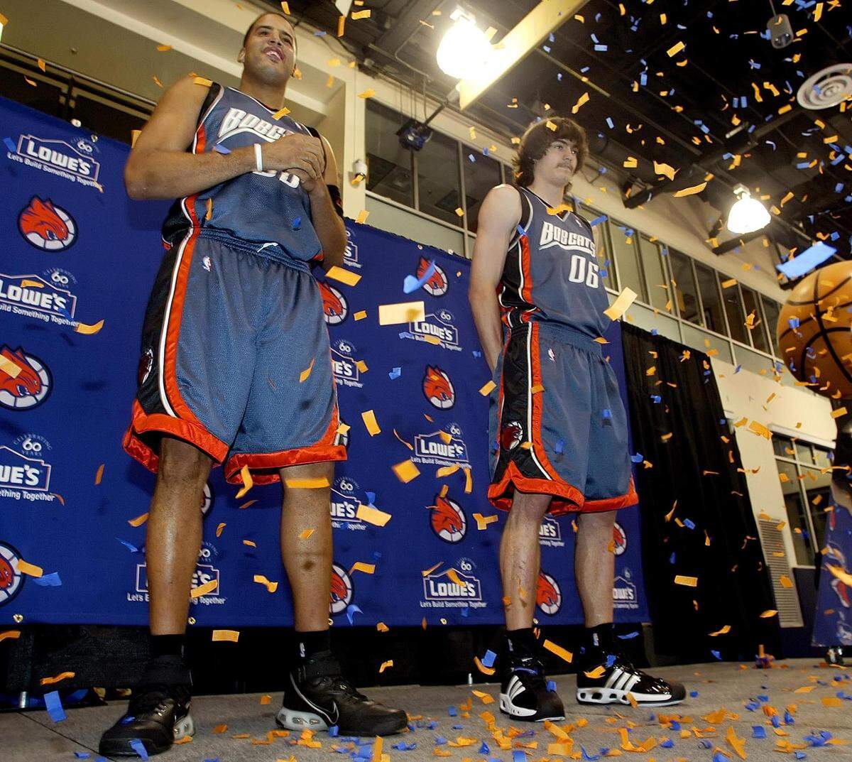 8/16/06 Charlotte Bobcats players Sean May (left) and Adam Morrison (right) model new alternative uniforms Wednesday, Aug. 16, 2006 at the Charlotte Bobcats Arena in Charlotte, N.C. CHRIS KEANE - SPECIAL TO THE OBSERVER
