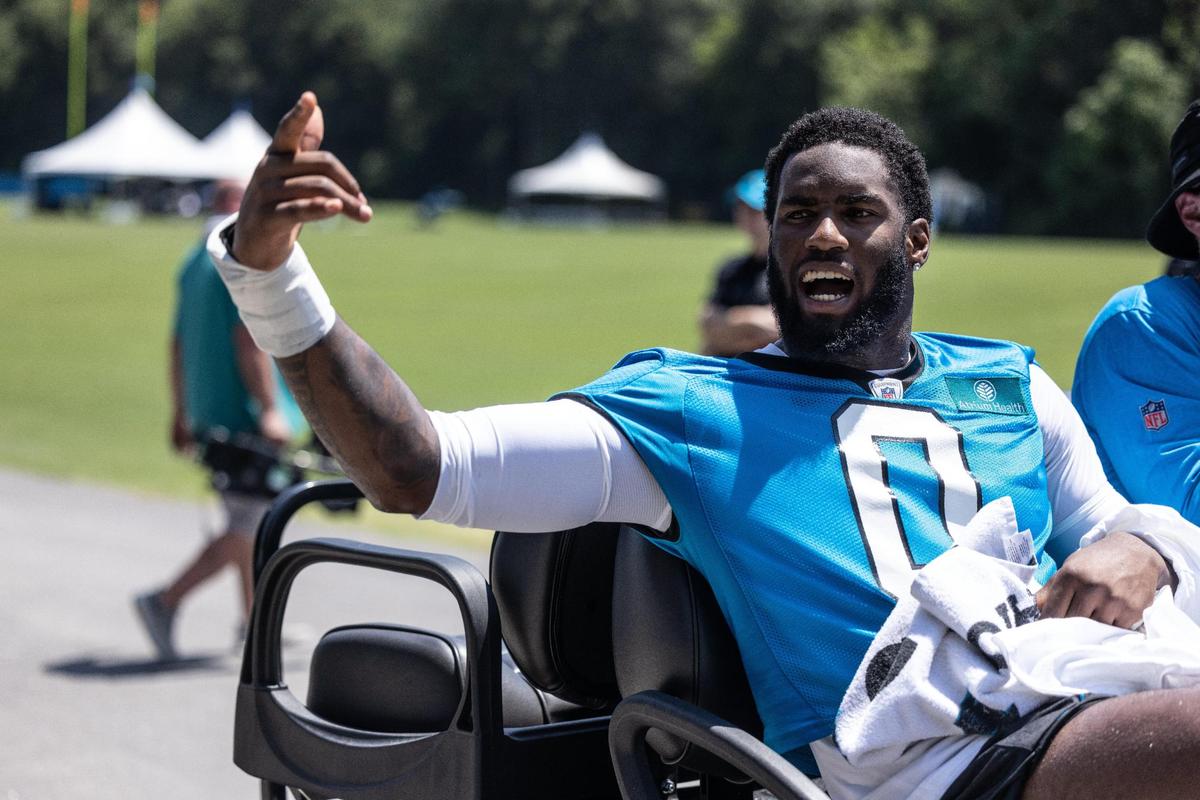 Carolina Panthers Brian Burns waves to fans after Panthers Training Camp at Wofford College in Spartanburg, N.C., on Wednesday, July 26, 2023.