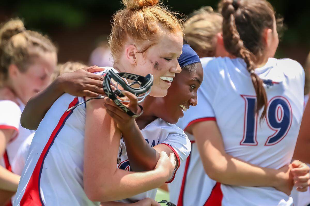 Providence Day teammates share an emotional hug after clinching the state championship title, sealing a season of hard work and resilience at the NCISAA state championship at Providence day school in Charlotte, North Carolina on May 17th, 2025