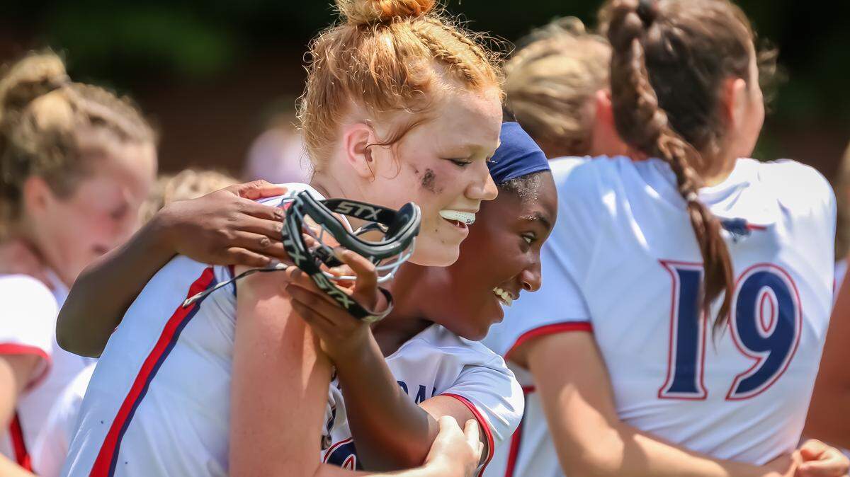 Providence Day teammates share an emotional hug after clinching the state championship title, sealing a season of hard work and resilience at the NCISAA state championship at Providence day school in Charlotte, North Carolina on May 17th, 2025
