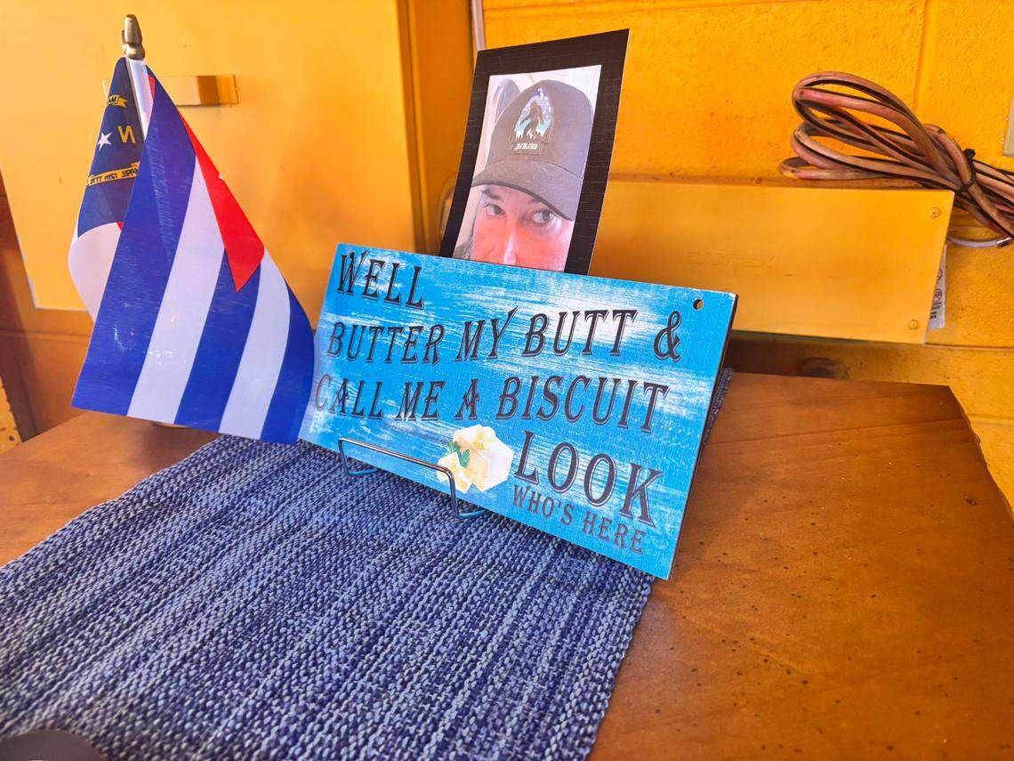 A sign made especially for Tony Prieto’s “Welcome to Asheville” party, with a photo of Prieto and the Cuban and North Carolina flags together.