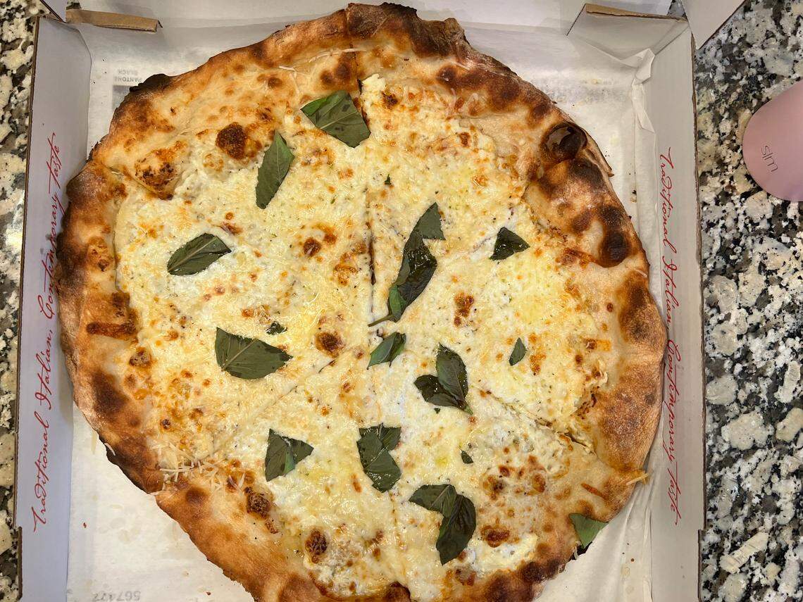 Bird Pizzeria’s white pizza has fresh mozzarella, ricotta, butter garlic, olive oil and basil toppings.
