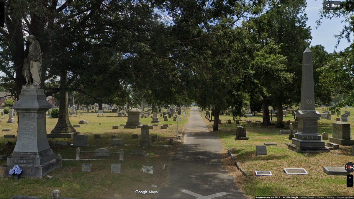 The masked man was found in Maplewood Cemetery in Kinston, NC, and he was hacking away at graves with strange weapons, police say.