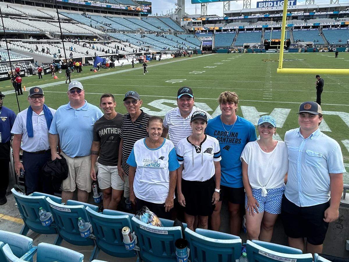 Friends and family of the Fitzgeralds gather at EverBank Stadium for a picture before the Carolina Panthers and Jacksonville Jaguars’ season-opener Sunday afternoon in Florida.