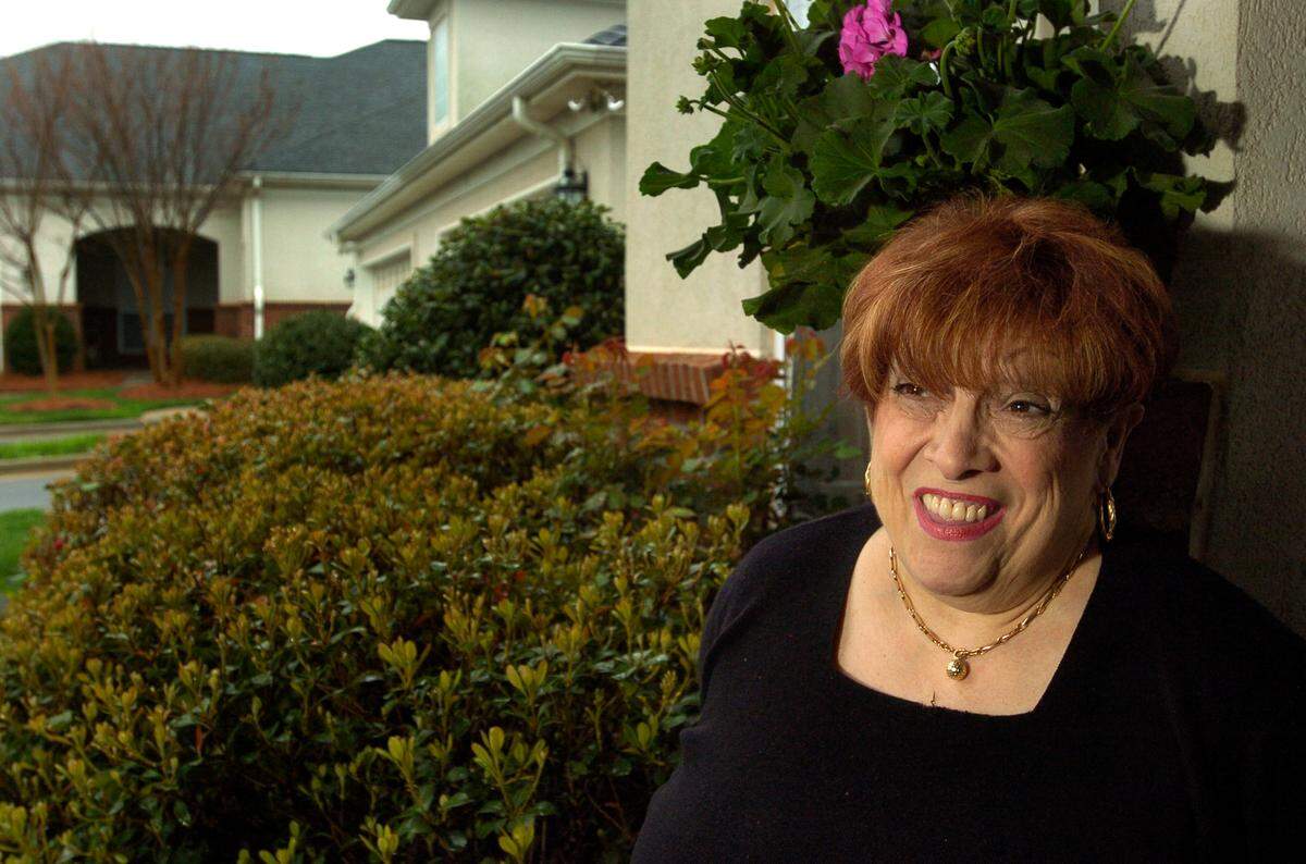 Photo from March 3, 2008. Claire Green Fallon in front of her condo in the Legacy Lake subdivision in north Charlotte.