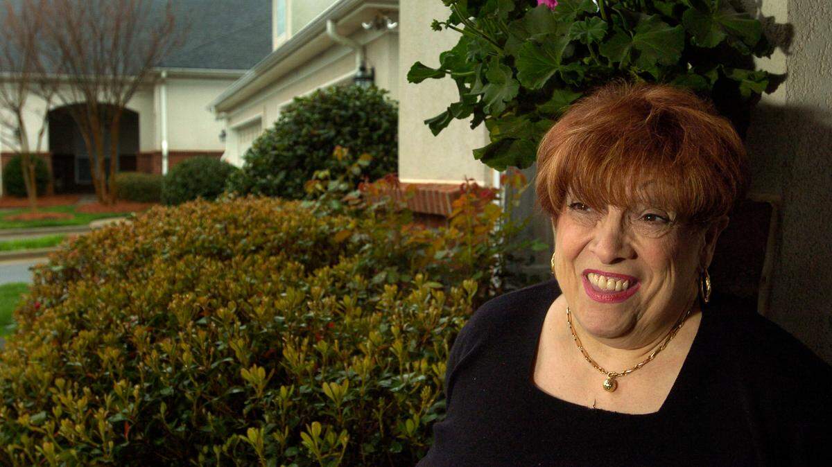 Photo from March 3, 2008. Claire Green Fallon in front of her condo in the Legacy Lake subdivision in north Charlotte.