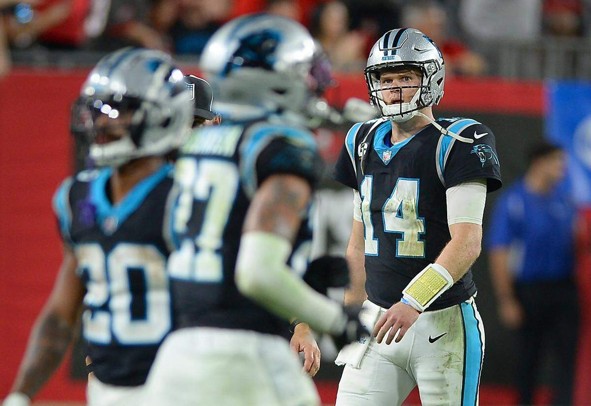 Carolina Panthers quarterback Sam Darnold walks to the teamÕs bench after throwing an interception to the Tampa Bay Buccaneers during fourth quarter action at Raymond James Stadium in Tampa, Fl. on Sunday, January 9, 2022. The Panthers lost to the Buccaneers 41-17.