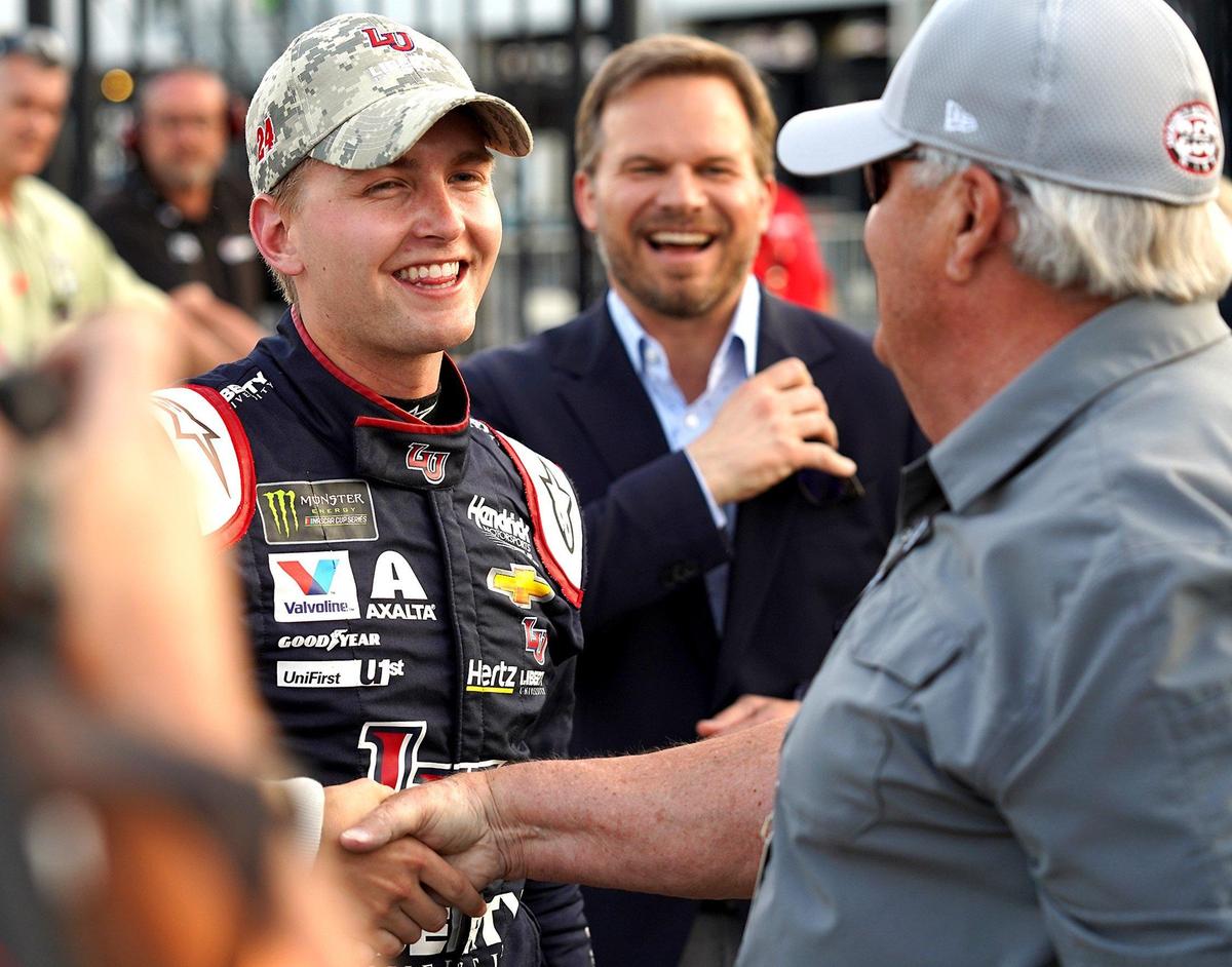 A phone call from NASCAR team owner Rick Hendrick, right, changed the career path for Charlotte native William Byron.