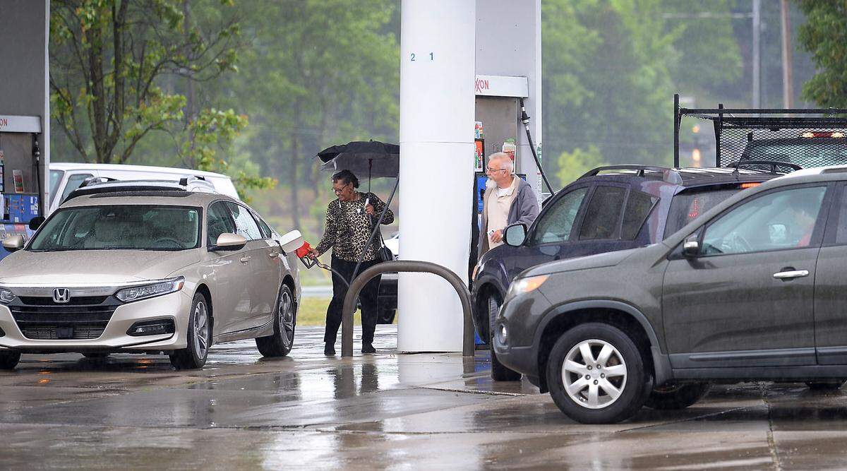 Drivers fill up their cars at the Exxon 7/11 station along 74 and Unionville Indian Trail Road in Indian Trail, NC on Wednesday, May 12, 2021.