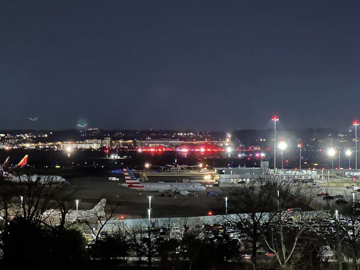 First responders attempt to locate the victims off the shores of the Potamac River in Washington, D.C. after a plane collided with a military helicopter in route to Reagan National Airport in Arlington, Va. on Wednesday, Jan. 29, 2025. The four-person crew reportedly was based in Charlotte.