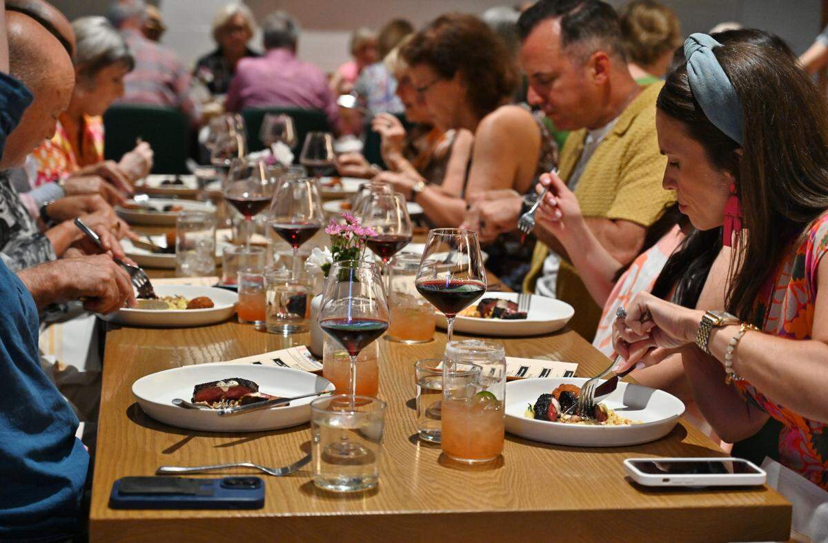 Food connoisseurs dig into Waygu beef at an exclusive June 9 dinner hosted by The Charlotte Observer and CharlotteFive at Restaurant Constance.