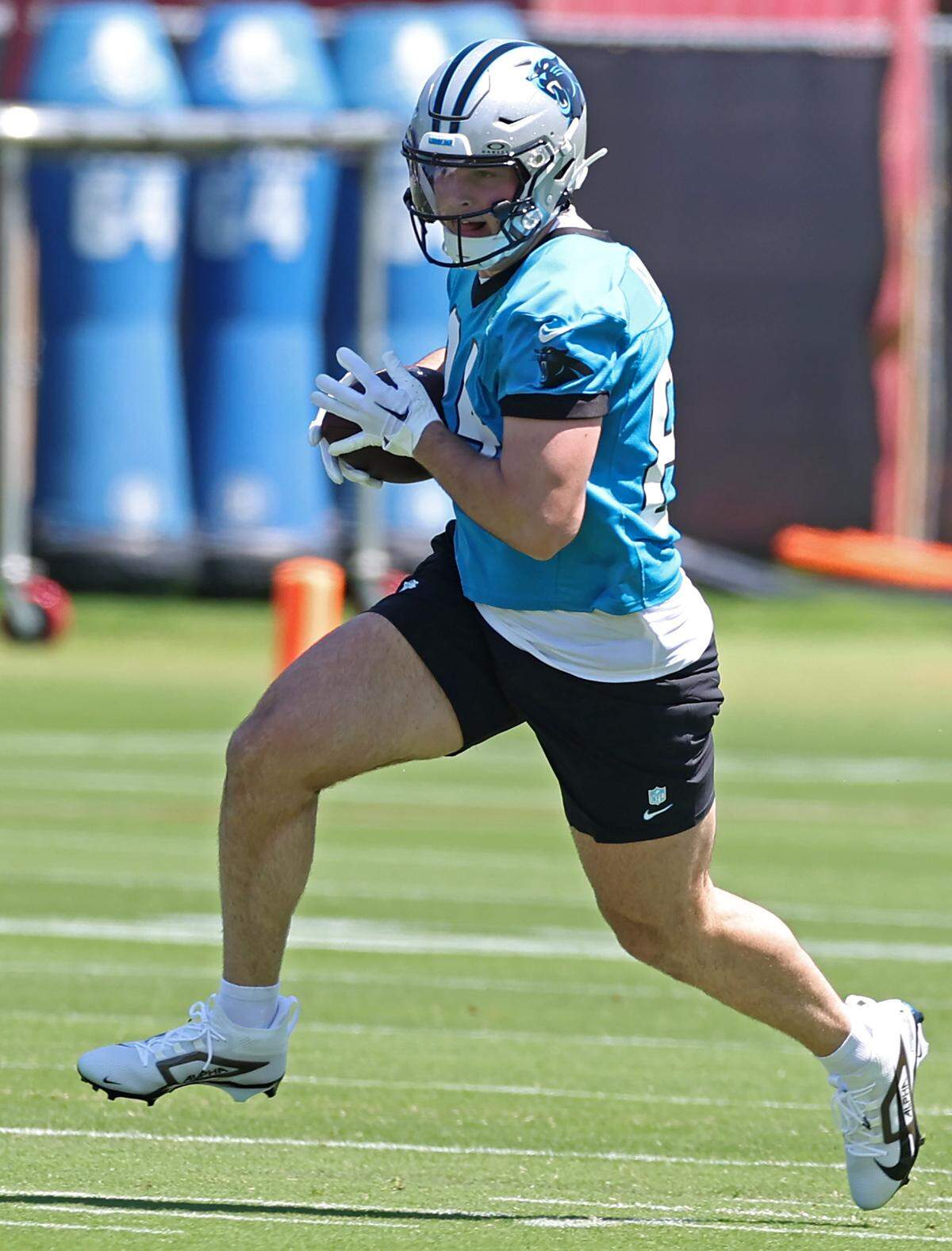 Carolina Panthers tight end Mitchell Evans runs downfield after catching a pass during the team’s rookie minicamp practice on Friday, May 9, 2025.