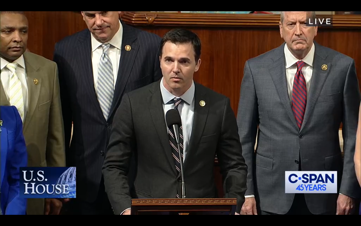 Rep. Jeff Jackson, a Charlotte Democrat, leads members of the North Carolina delegation in asking the U.S. House of Representatives to pause for a moment of silence to mourn and honor those killed and injured during a shooting in Charlotte. At right is Republican U.S. Rep. Dan Bishop - Jackson’s opponent this year in the state attorney general’s race.