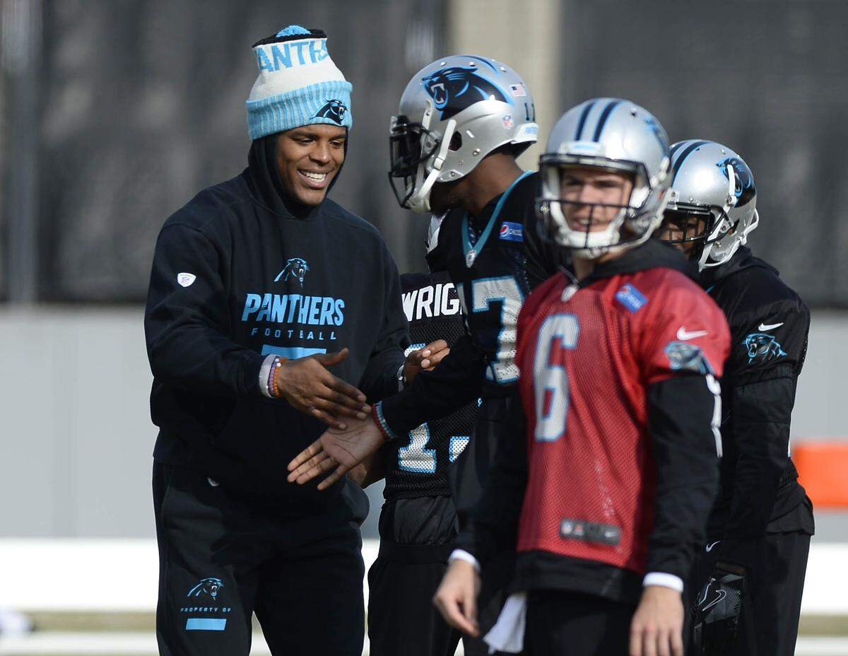 Cam Newton, left, was engaged in developing Taylor Heinicke, 6, and Kyle Allen last season.