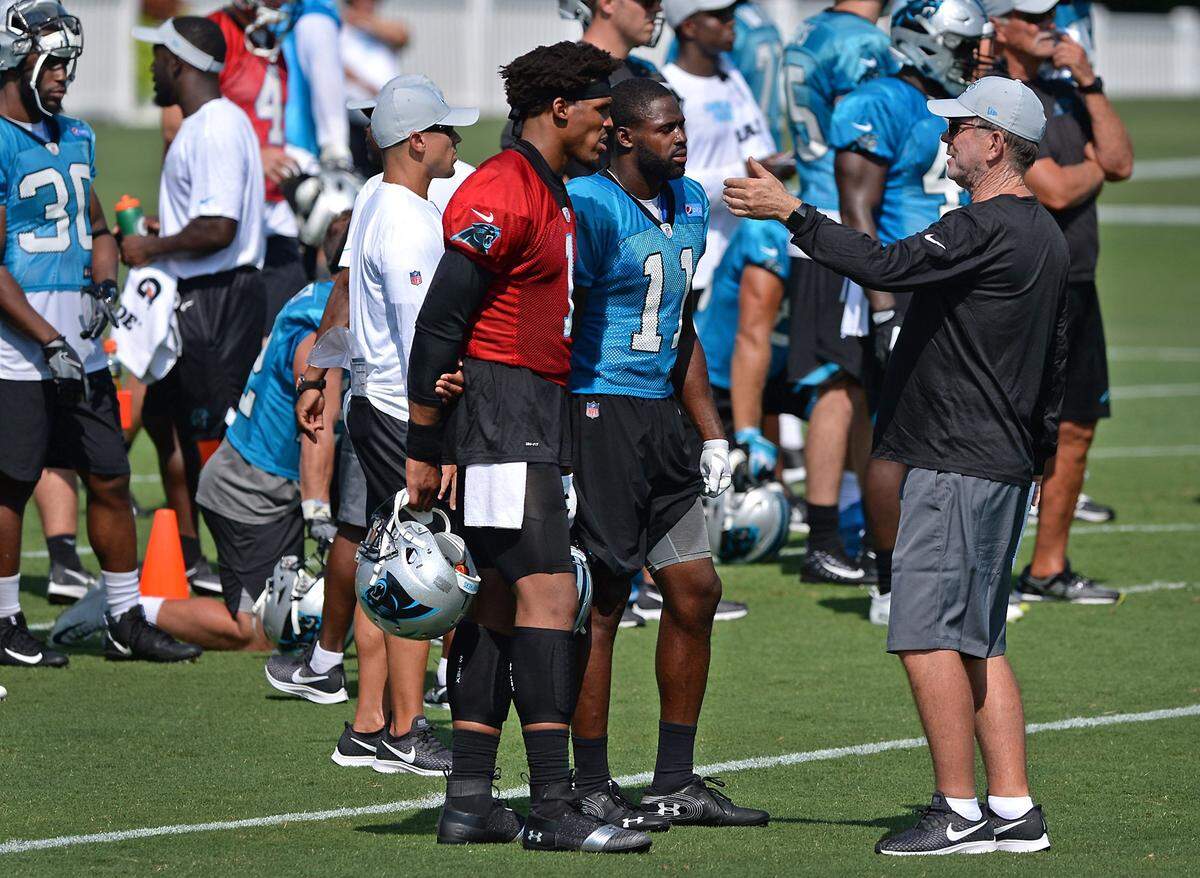 Carolina Panthers quarterback Cam Newton, left and wide receiver Torrey Smith, center, listen to offensive coordinator Norv Turner, right, during a break in practice on Friday, July 27, 2018 at Wofford College in Spartanburg, SC. The Panthers are holding training camp at Wofford College.