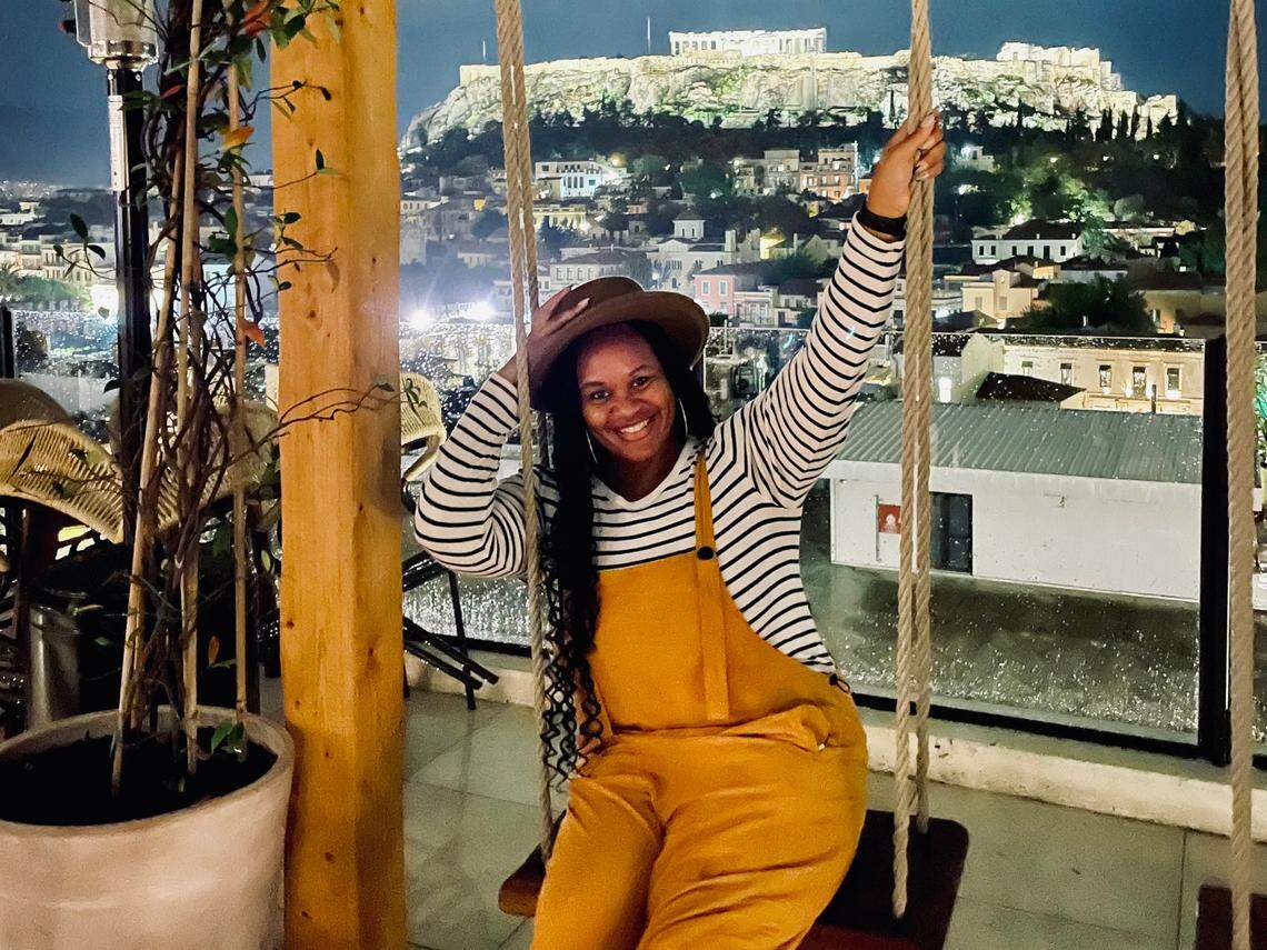 DeAnna Taylor swings at a rooftop bar in Athens, Greece.