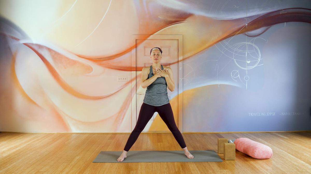 Jillian Longsworth of NoDa Yoga, in front of the studio’s new mural by Sydney Duarte and Nick Napoletano. NoDa Yoga is offering online classes during COVID-19.