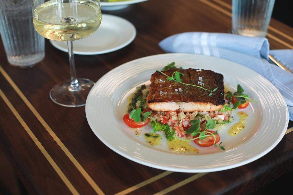 800° Woodfired Kitchen’s Woodfired Salmon entree is gluten free, made with a lemon-caper citronette and quinoa tabbouleh ($36).