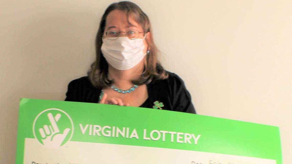Robin Meador shows off her Virginia Lottery winnings.