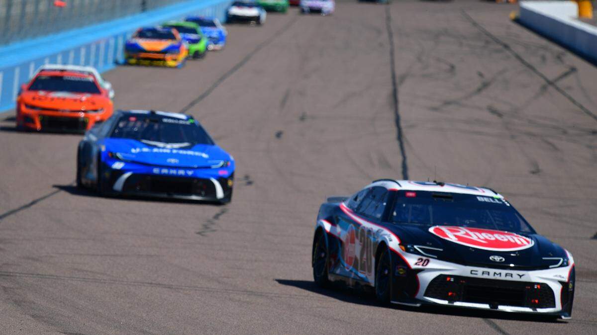Mar 10, 2024; Avondale, Arizona, USA; NASCAR Cup Series driver Christopher Bell (20) leads a group during the Shriners Children’s 500 at Phoenix Raceway.