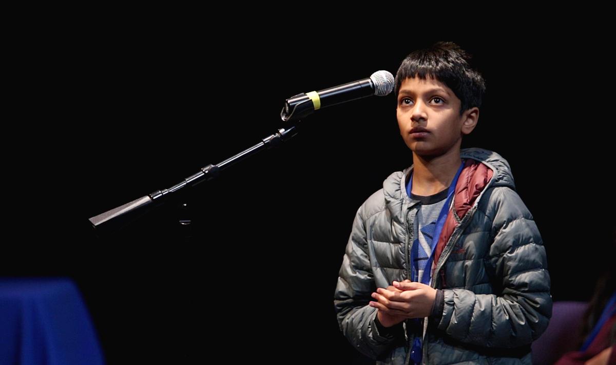 Grisham Paimagam thinks through the spelling of a word before correctly answering during the regional Charlotte Observer Spelling Bee. He went on to win the bee in the 50th round against