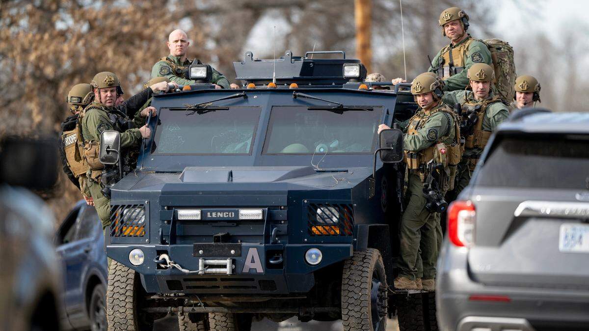 Missouri Highway Patrol SWAT team members leave the scene of a standoff in Kansas City on March 1, 2023.