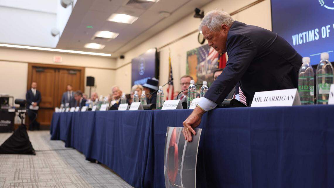 Rep. Ralph Norman, a South Carolina Republican whose district borders Charlotte, reaches for a poster sized image of Iryna Zarutska being stabbed during The House Judiciary Subcommittee on Oversight hearing in Charlotte on Monday.