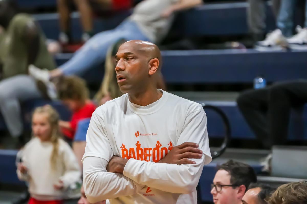 Providence Day head coach Ron Johnson watches his team at they tip off against Concord Academy at Providence Day high school on Dec 14th, 2024