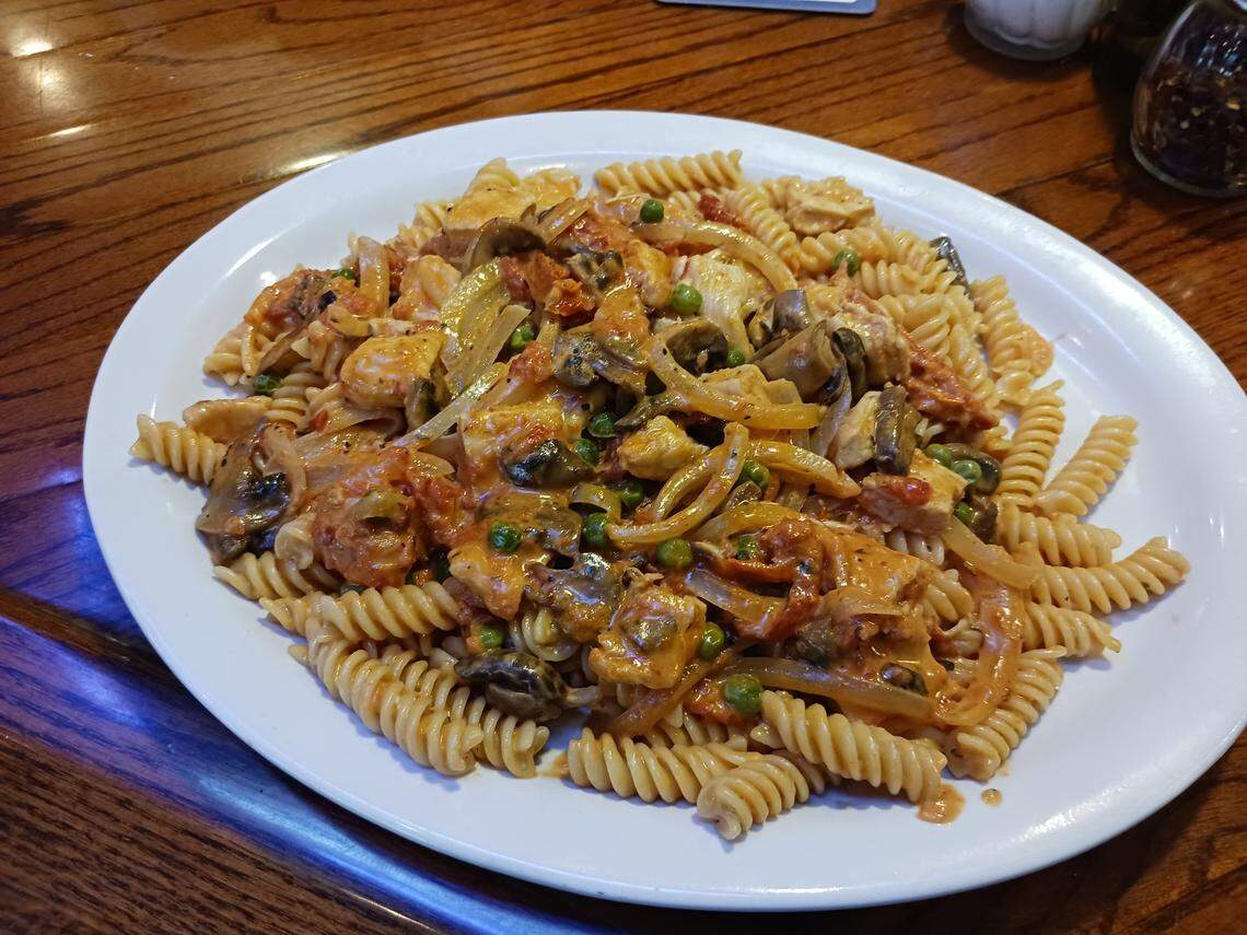 Pasta Campagnola (Fusilli pasta with chicken, mushrooms, onions, peas and sun-dried tomatoes in a pink sauce) at Sebastiano’s Pizzeria in Mooresville.