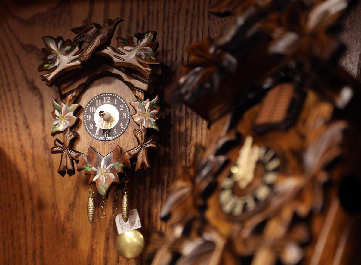 Hans & Heidi’s Holiday Haus by Charlotte Christmas Village features a collection of authentic German Erzgebirge handcrafts like these traditional cuckoo clocks for sale at the Light the Knights Festival.