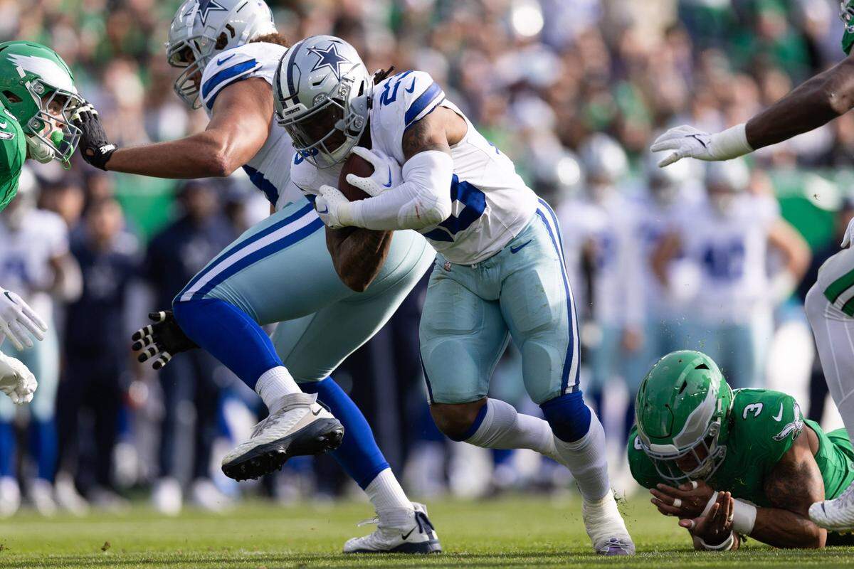 Dec 29, 2024; Philadelphia, Pennsylvania, USA; Dallas Cowboys running back Rico Dowdle (23) runs with the ball against the Philadelphia Eagles during the first quarter at Lincoln Financial Field. Mandatory Credit: Bill Streicher-Imagn Images