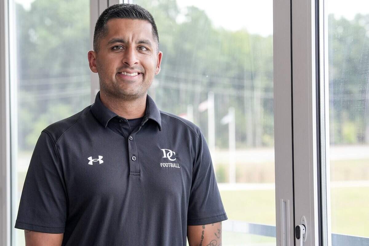 Davidson College football coach Saj Thakkar poses for a photo Friday, Aug. 1, 2025, in Davidson, N.C.
