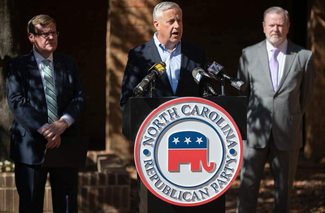 North Carolina Republican Party Chairman Michael Whatley, flanked by House Speaker Tim Moore, left and Senate leader Phil Berger tout the GOP victories across North Carolina during a press briefing on Wednesday, November 4, 2020 in Raleigh,