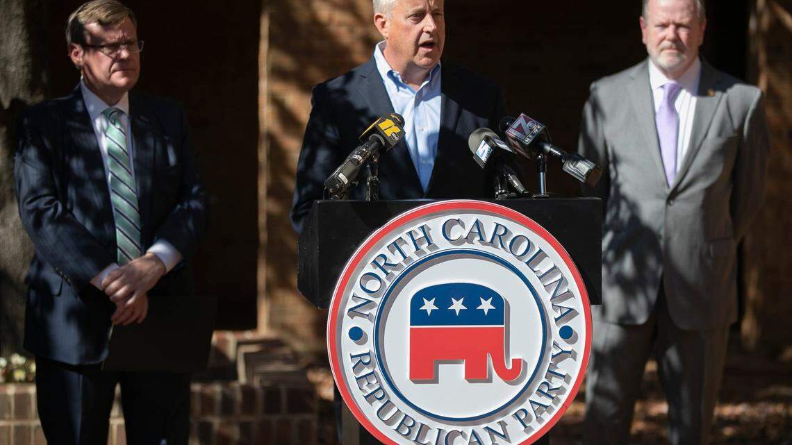 North Carolina Republican Party Chairman Michael Whatley, flanked by House Speaker Tim Moore, left and Senate leader Phil Berger tout the GOP victories across North Carolina during a press briefing on Wednesday, November 4, 2020 in Raleigh,