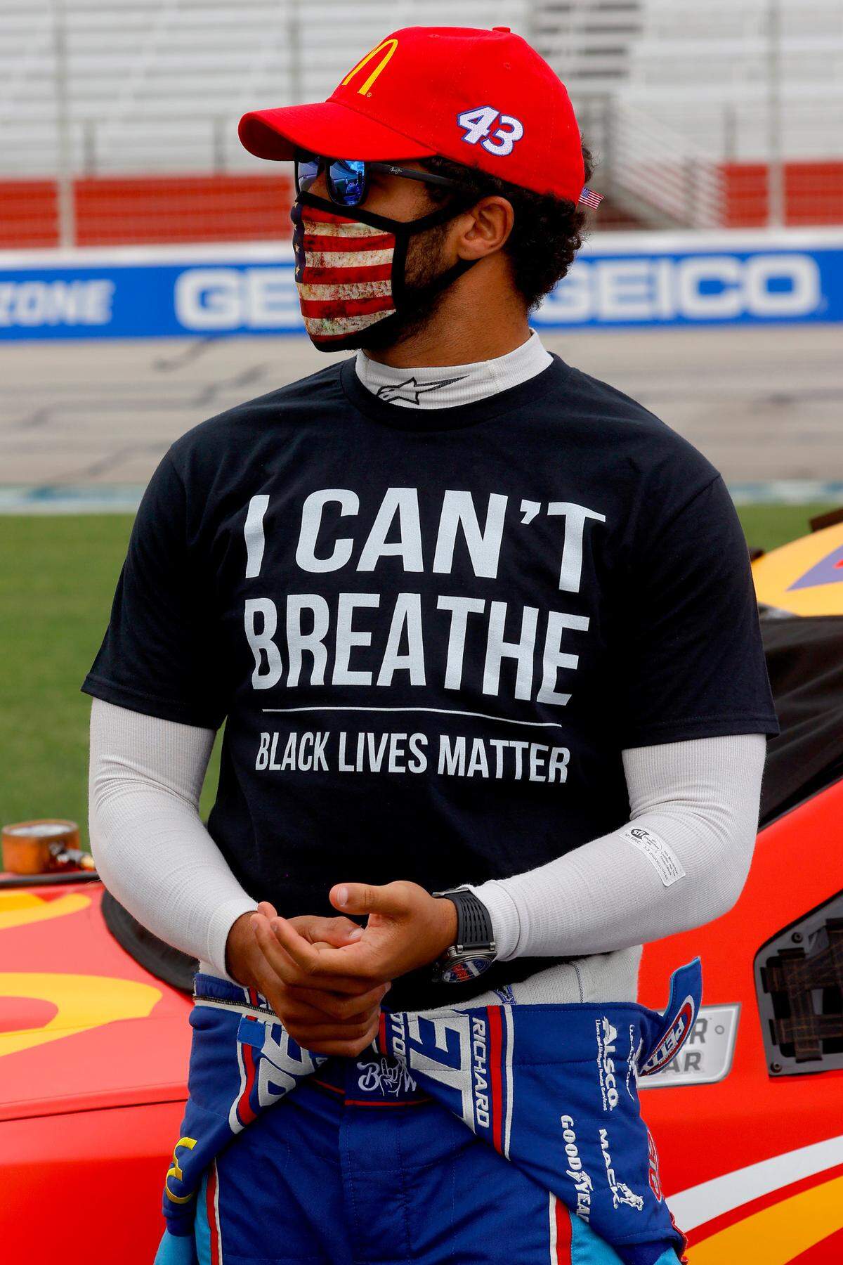 NASCAR driver Bubba Wallace wears an “I Can’t Breath/Black Lives Matter” t-shirt under his fire suit on the grid prior to the Cup Series Folds of Honor QuikTrip 500 race at Atlanta Motor Speedway on June 7, 2020 in Hampton, Georgia.