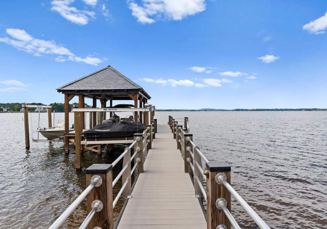 Enjoy the lake by the private dock with dual slips and watercraft lifts.