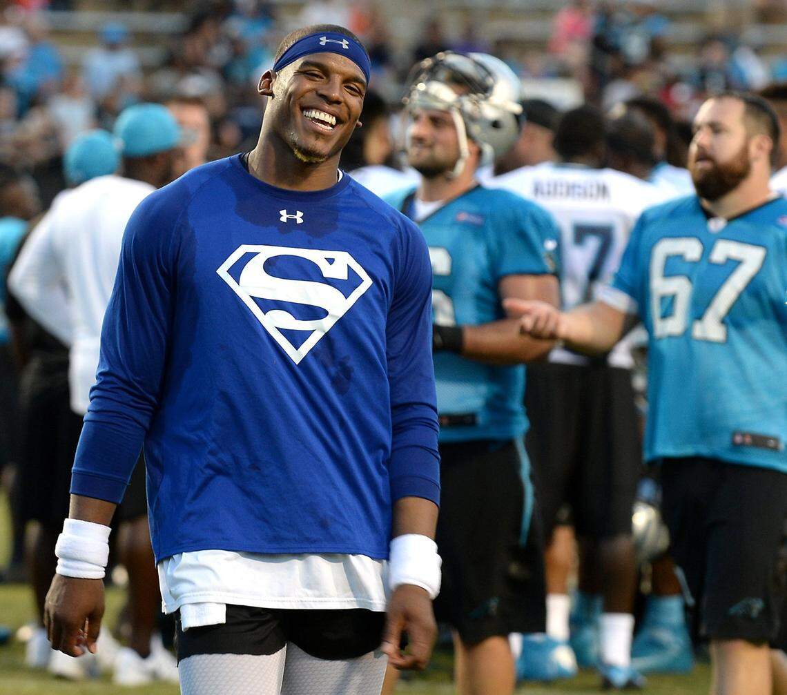 Former Carolina Panthers quarterback Cam Newton smiles in 2016 after a training camp practice.