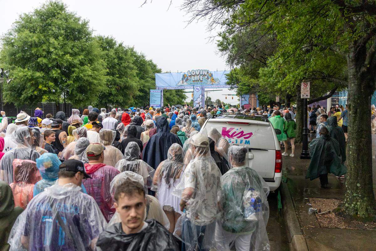 Fans awaiting re-entry after a storm at Lovin’ Life Music Fest.