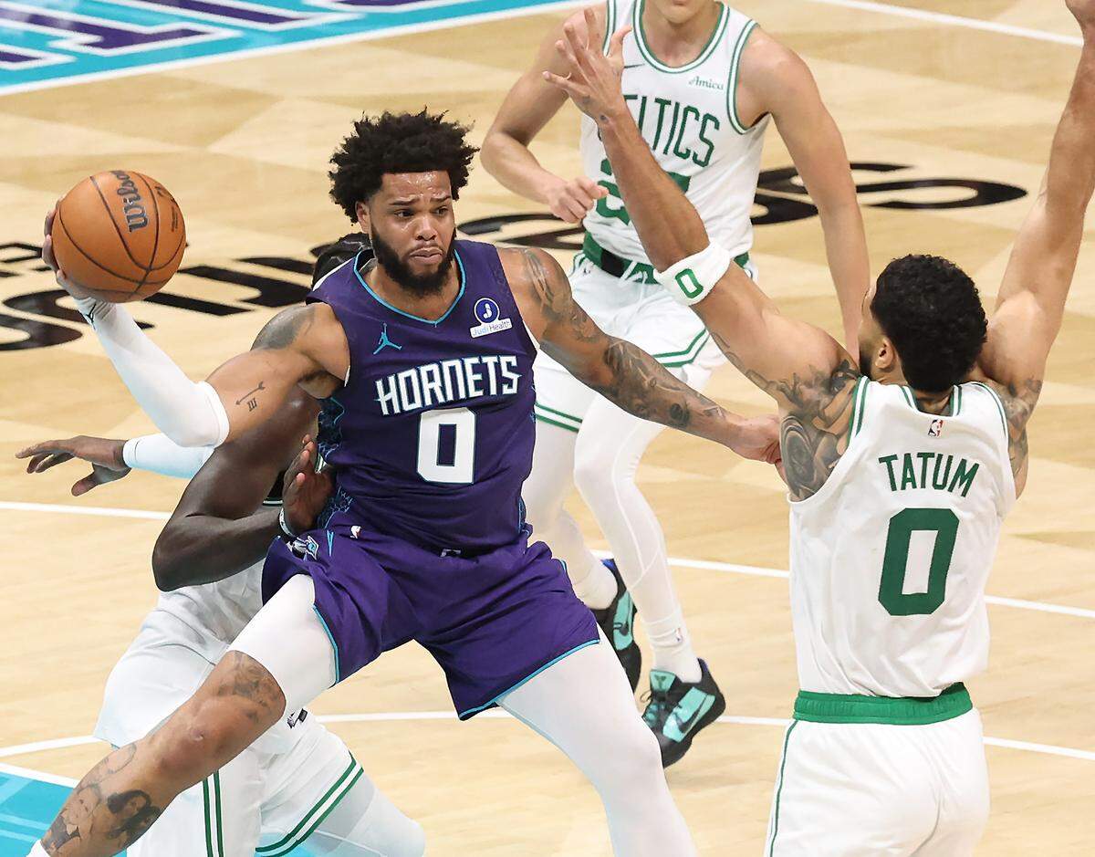 Charlotte Hornets forward Miles Bridges (center) looks to pass out of a double-team. The Boston Celtics defeated the Hornets 114-99 Sunday in Charlotte, which was the Hornets’ second straight loss.