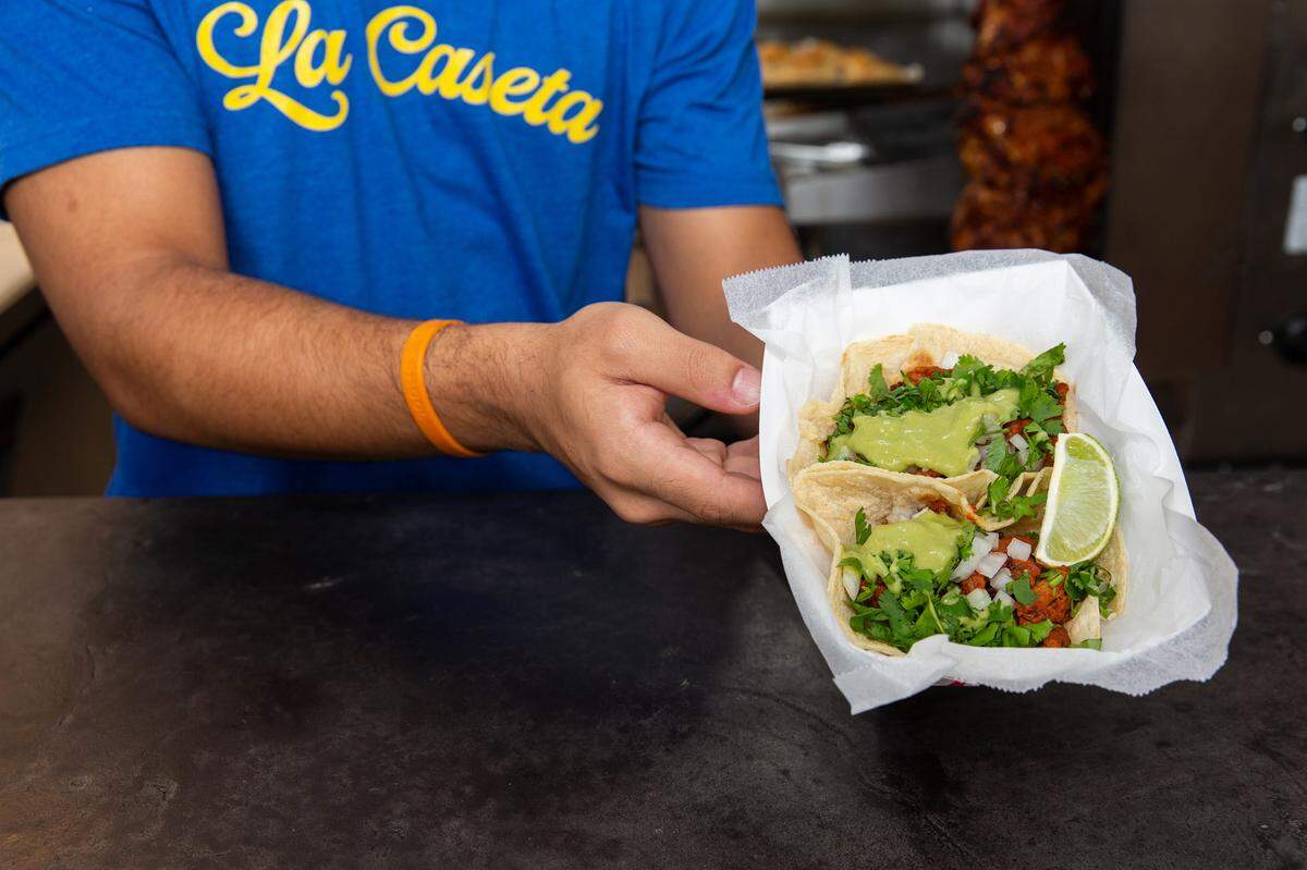 La Caseta’s Al Pastor tacos are handmade corn tortillas with pork adobo, onions and pineapple, then topped with cilantro, onion and salsa roja.