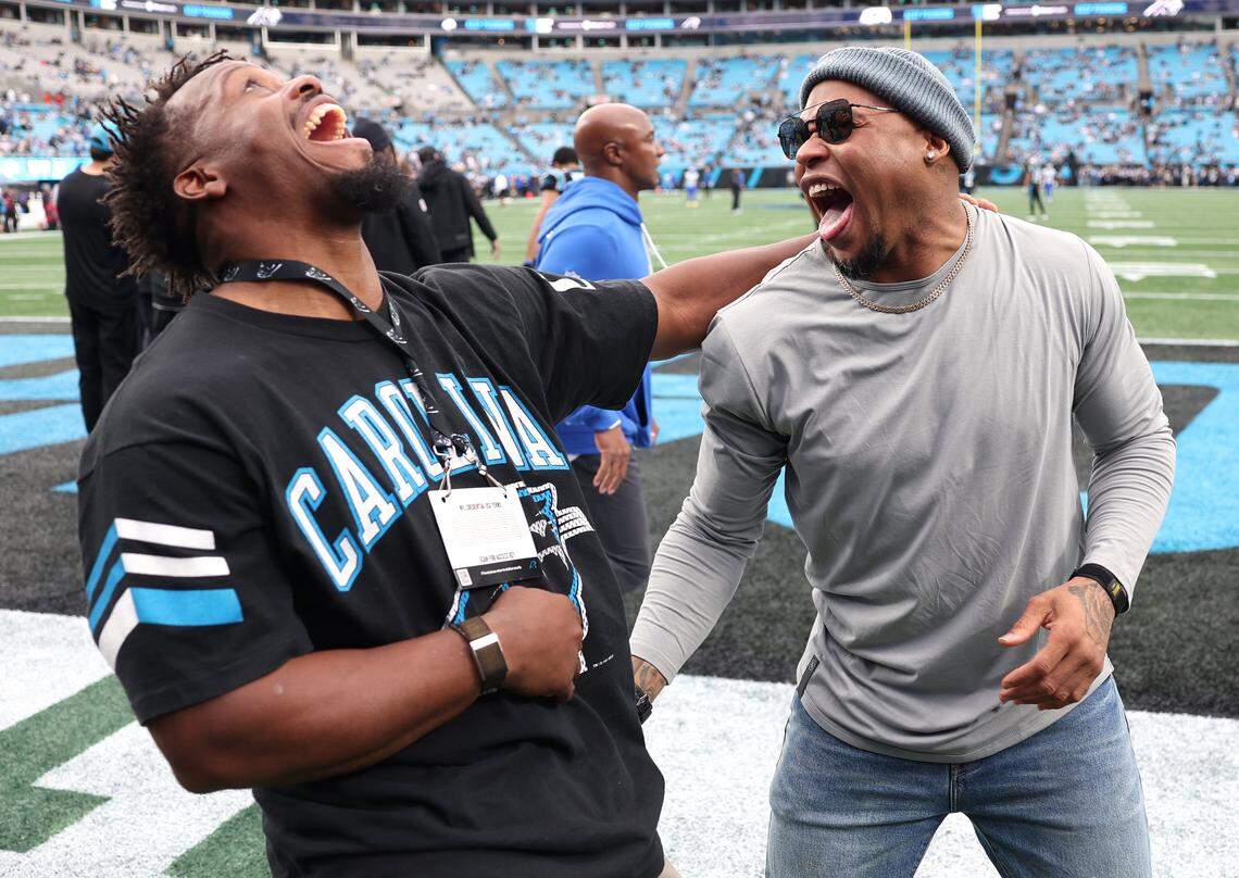 Former Carolina Panthers running back Jonathan Stewart, left and wide receiver Steve Smith, right, enjoy time together prior to the team’s game against the Los Angeles Rams at Bank of America Stadium on Saturday, January 10, 2026. The Rams defeated the Panthers 34-31.