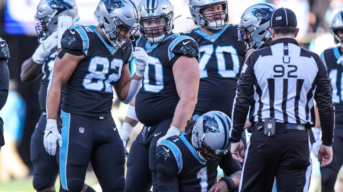 Carolina Panthers Cam Newton kneels after the Atlanta Falcons recovered a fumble at the Bank of America Stadium in Charlotte, N.C., on Sunday, December 12, 2021.