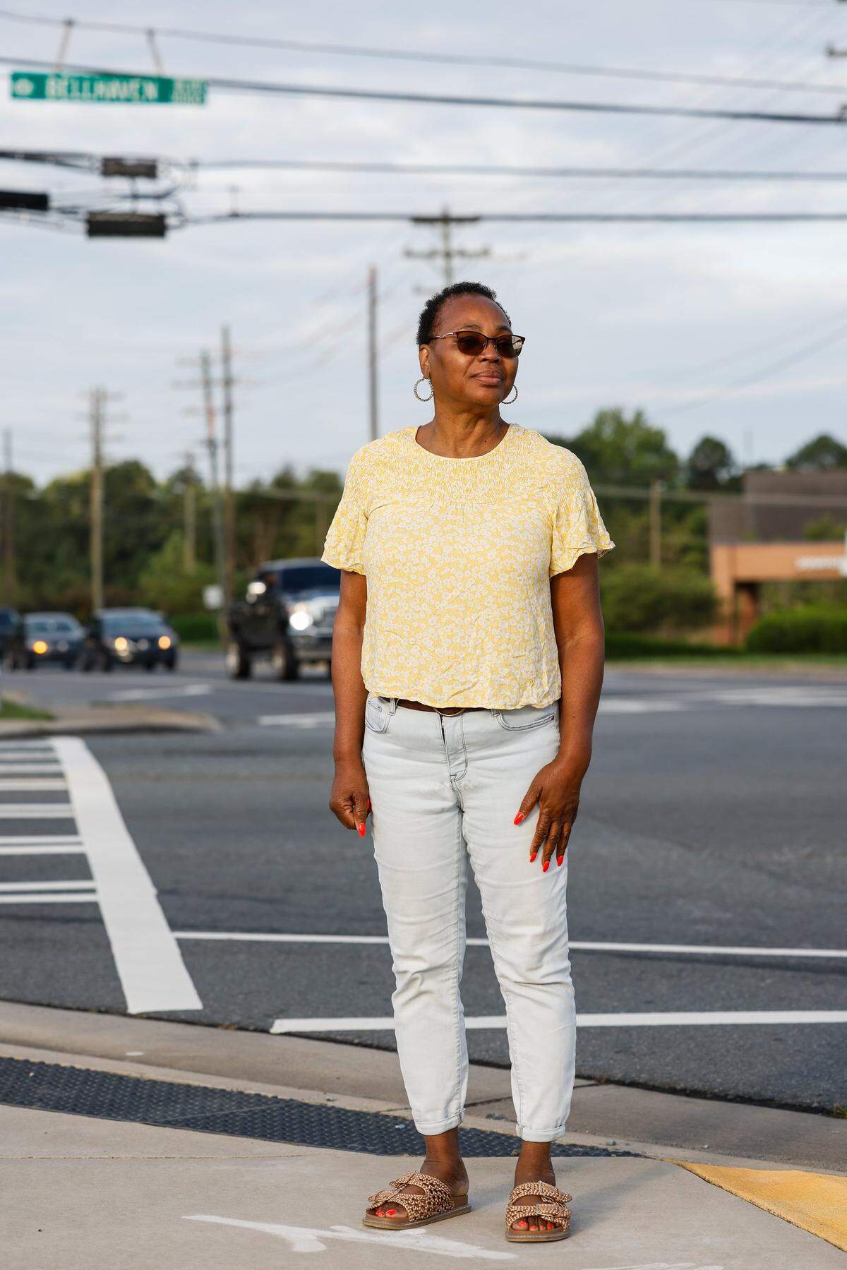 Michelle Mitchell at the intersection of Mt. Holly-Huntersville Road and Bellhaven Boulevard in Charlotte. Mitchell appreciates what growth in the area has created, more housing and retail. But the congestion along Mt. Holly-Huntersville Road has become a safety issue. 