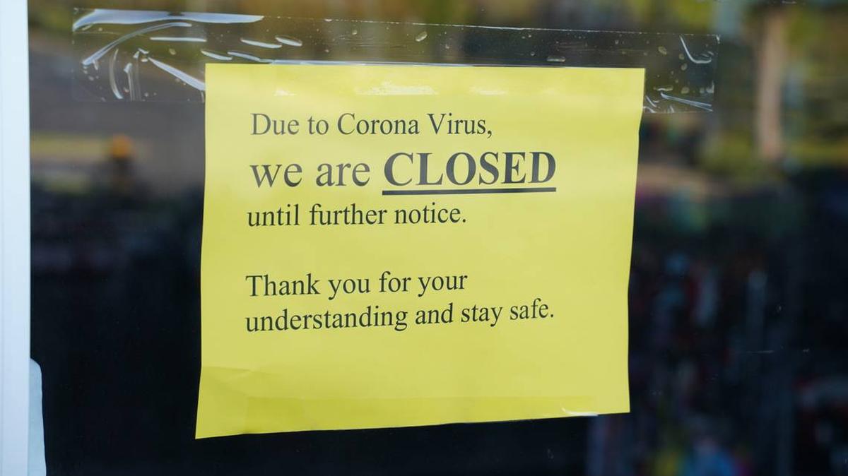 Businesses across the US have been forced to close due to the coronavirus pandemic, putting millions out of work. This sign is posted on the door of Hope Beauty Supply in Charlotte.