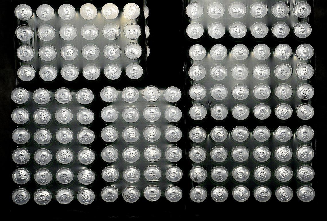 Pallets of Coca-Cola product inventory wait to be sorted for orders in the automated warehouse.