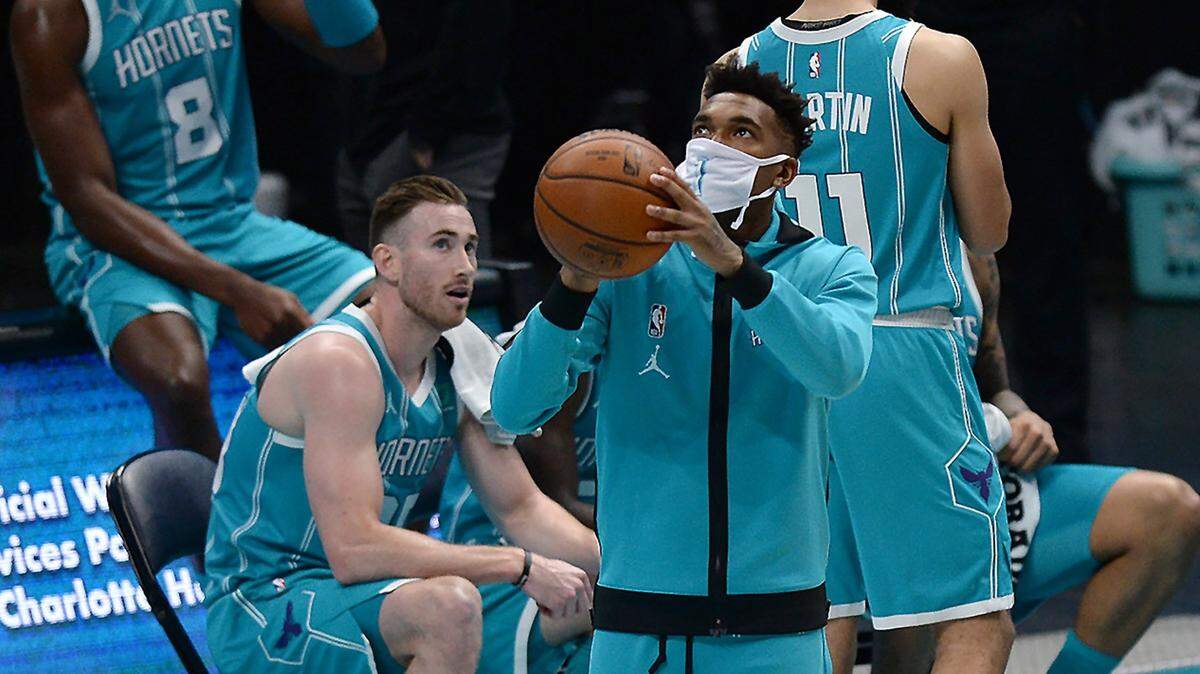 Charlotte Hornets guard Malik Monk (in mask) didn’t play in the first three games of the season, after missing a week of training camp with COVID-19. A study published in JAMA Cardiology, suggests that heart complications are uncommon in pro athletes who have had COVID-19.