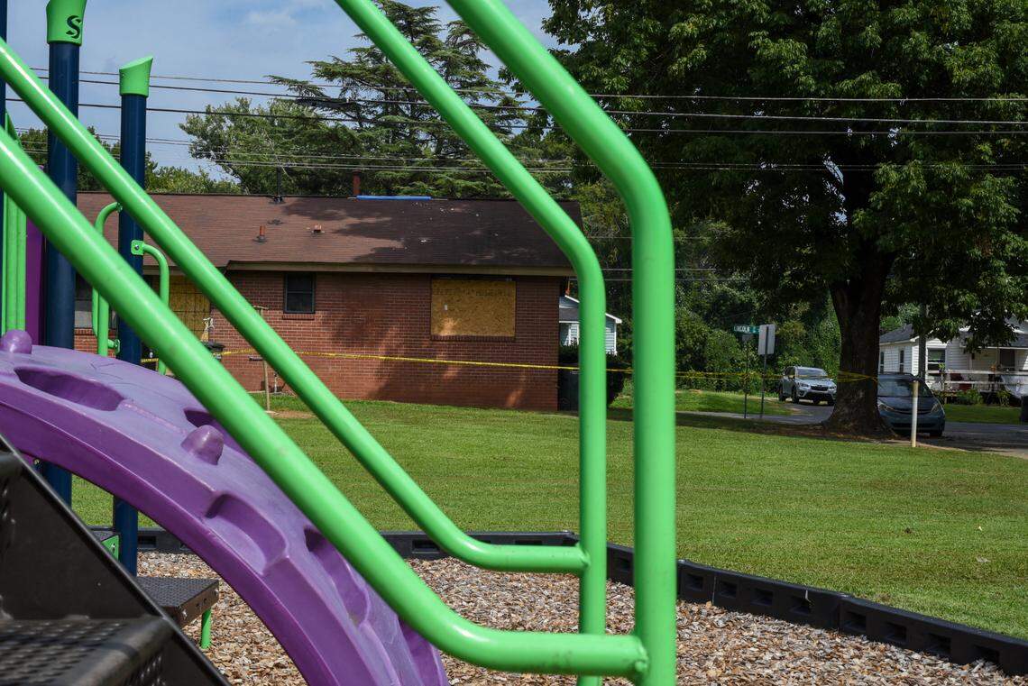 An empty playground sits behind a unit that caught fire in Concord, N.C., on Sunday, Aug. 20, 2023. Three children died inside the unit, which is owned and maintained by the city.